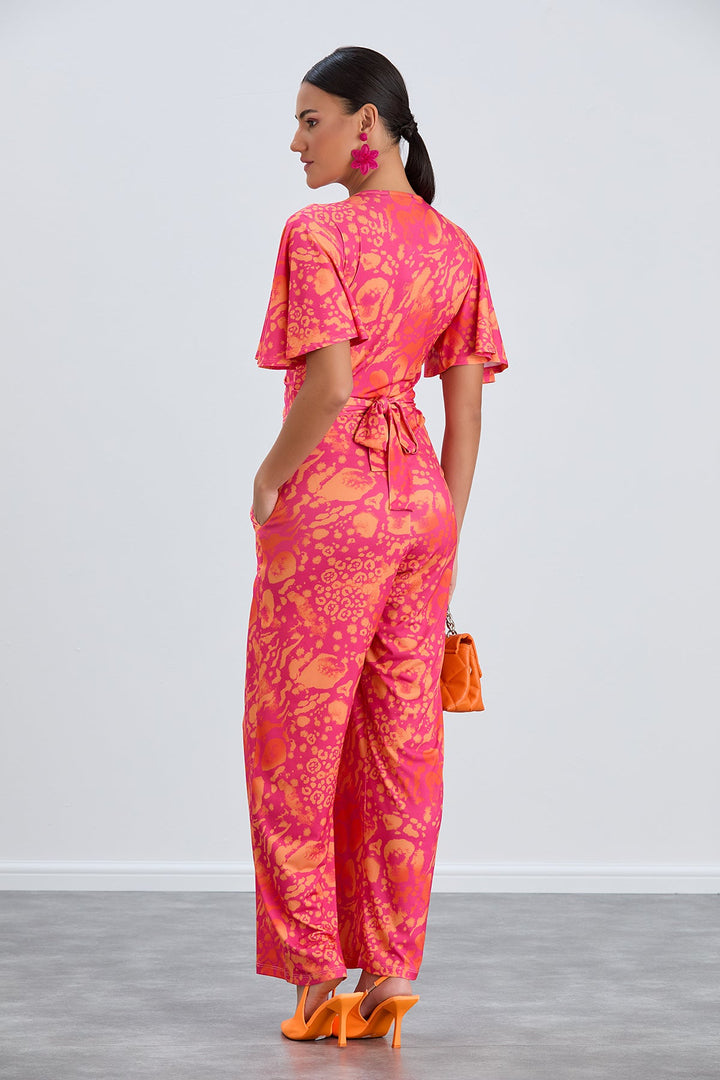 Angel Sleeve Twist Maxi Jumpsuit in Tropical Fuchsia print